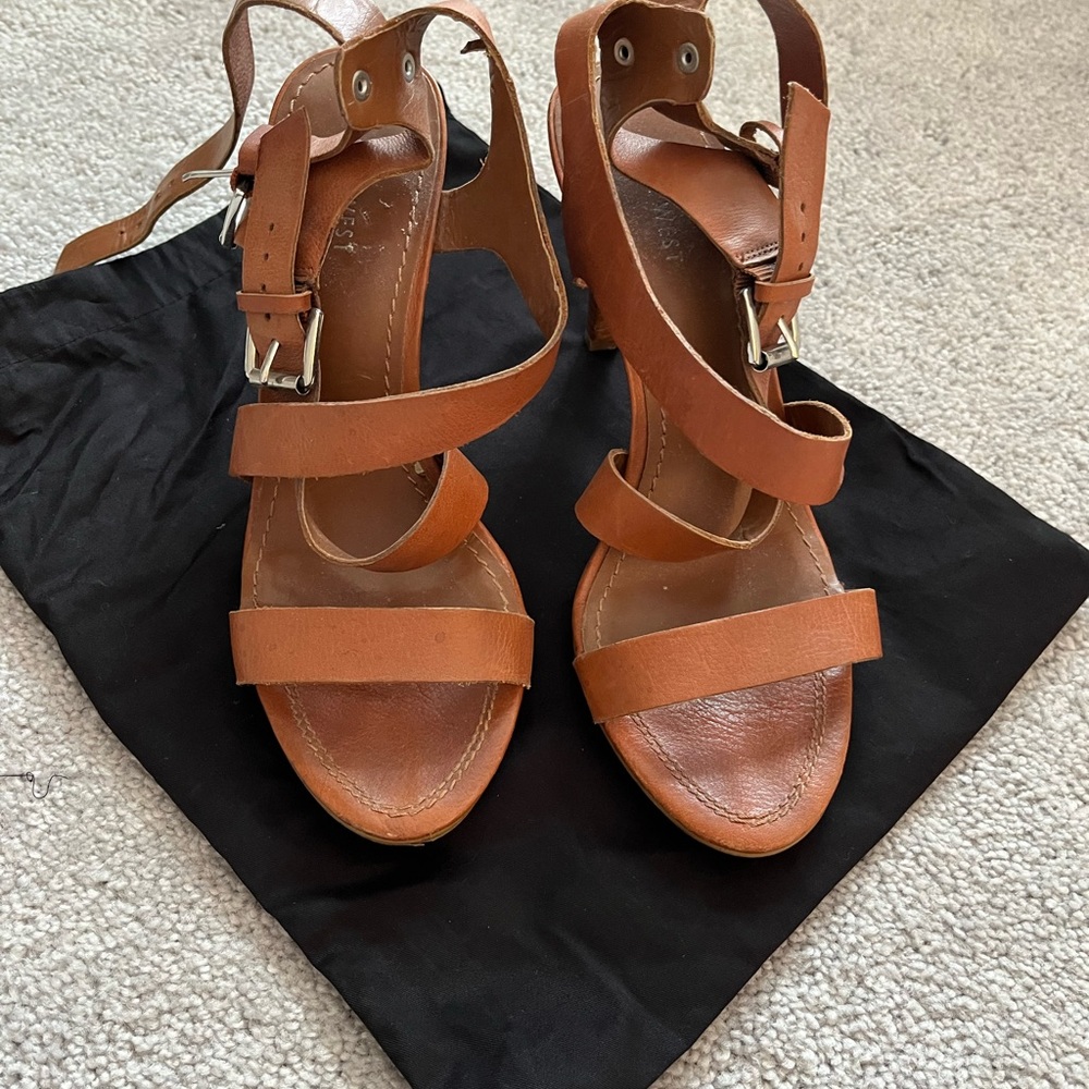 Brown Nine West heeled sandals with gold buckles and ankle straps